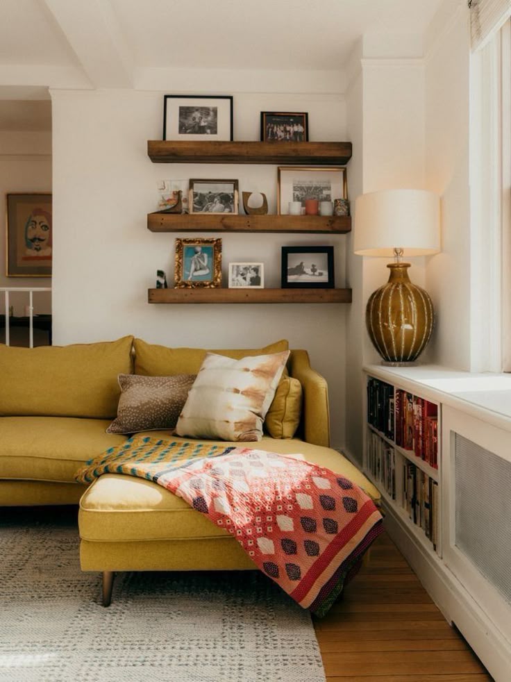 photo of a living room with a candle lit in the background